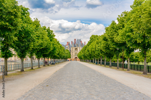 Alley to Fontainebleau palace (Chateau de Fontainebleau) in Paris suburbs, France