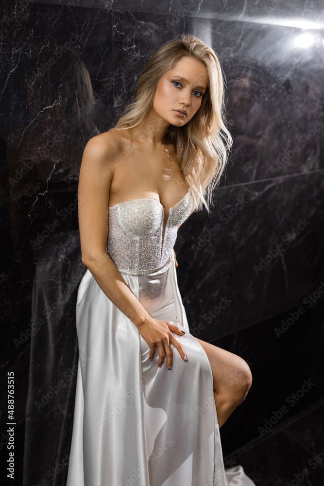 elegant stylish female in a delicate wedding dress on a black background elegant stylish female in a delicate wedding dress on a black background