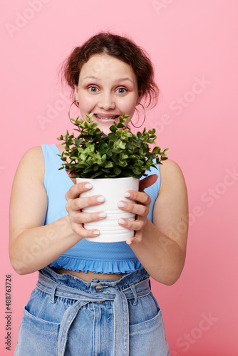 cheerful woman potted flower posing plant cropped view unaltered