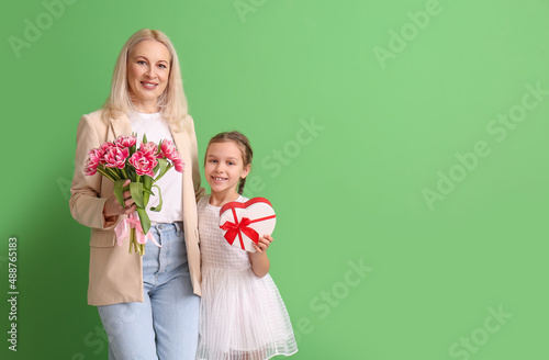 Mature woman with her littl...