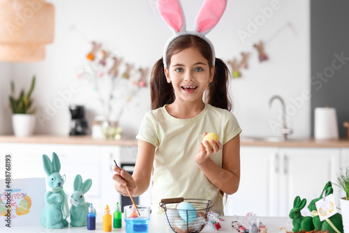 Funny little girl painting ...