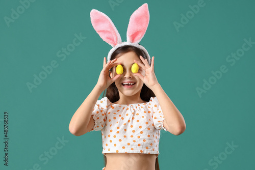 Funny little girl with bunn...