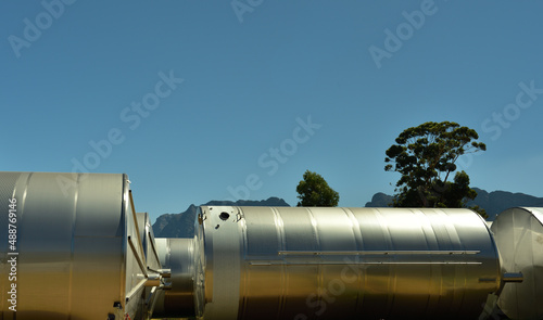 Huge modern stainless steel wine tanks waiting to be installed