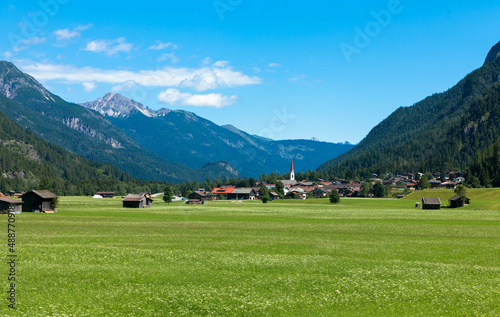 Panoramic view of a idyllic landscape with a mountains and blue sky in the Bavarian Alps against blue sky. Tannheimer Tal, Reutte, Austria