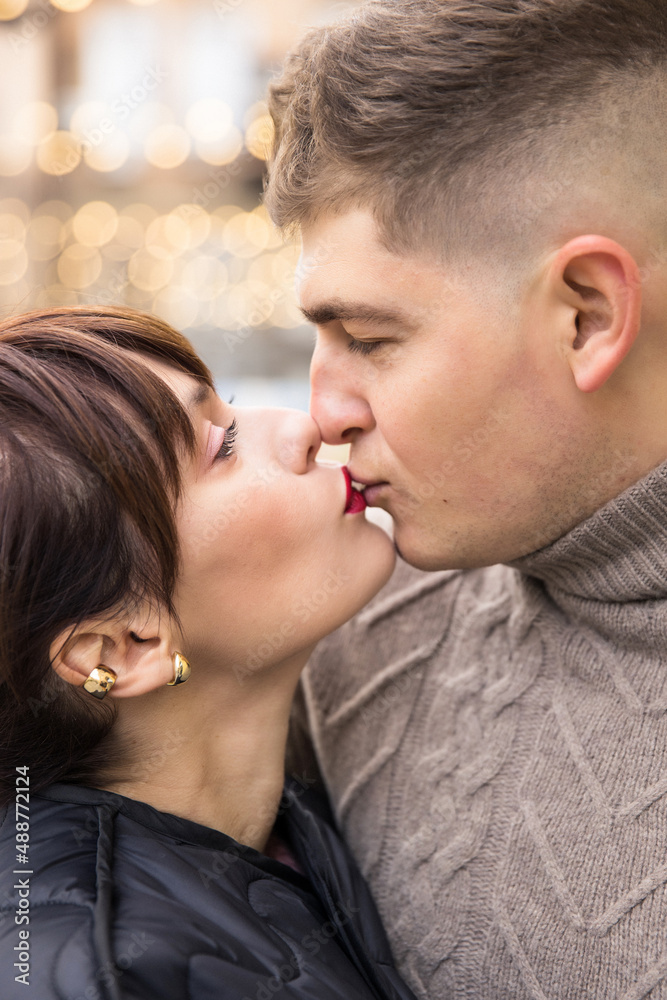 young beautiful couple walking and having fun on the city street young beautiful couple walking and having fun on the city street