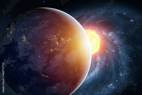 Planet earth planet in deep space against blue nebula and glowing hot sun. Outer space dark wallpaper with Eatrh surface view. Elements of this image furnished by NASA.