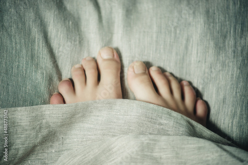 feet on the bed close-up © Marina