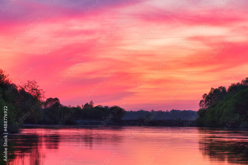 red bloody sunset over the river in summer red bloody sunset over the river in summer