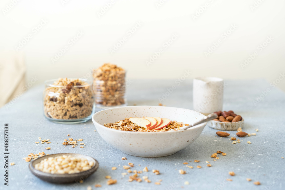 Homemade granola with milk, apples and nuts. Delicious and healthy breakfast. Homemade granola with milk, apples and nuts. Delicious and healthy breakfast.