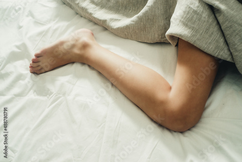 foot on the bed close-up © Marina