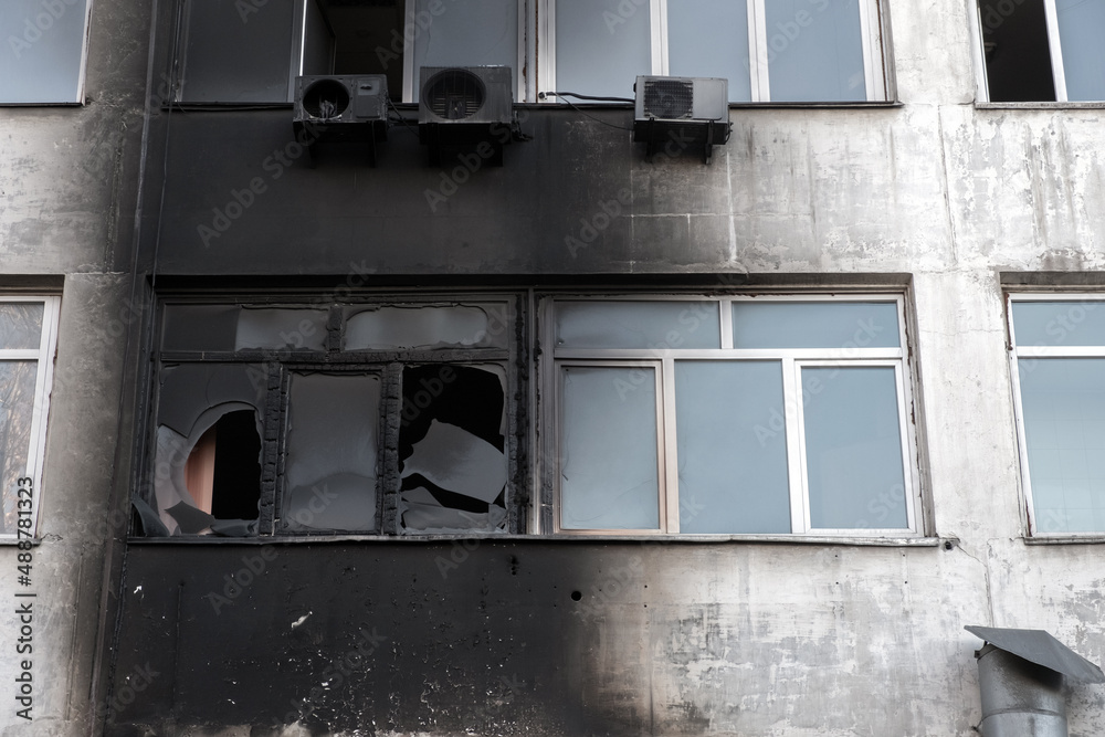 Burnt facade of building. Black walls after fire. Arson concept. Destroyed burned walls after fire extinguished. Burnt facade of building. Black walls after fire. Arson concept. Destroyed burned walls after fire extinguished.