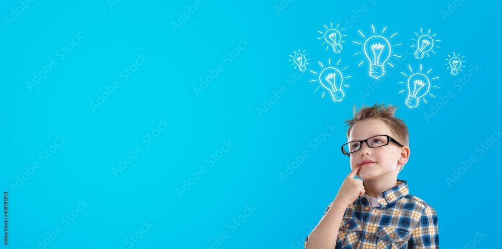 Smart kid nerd child with light bulb have good idea. Happy student Smart kid nerd child with light bulb have good idea. Happy student