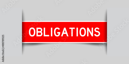 Inserted red color label sticker with word obligations on gray background