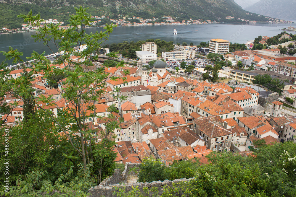 Top view of old city houses and sea on a summer day. Kotor. Montenegro.