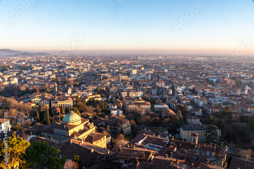 The lower city of Bergamo bassa view from the Fortress in the upper city at sunset, Italy, Europe