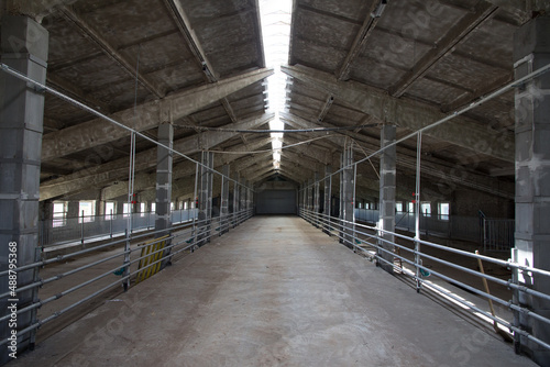 Industrial building of a farm. Hangar. Hangar from sandwich panels. Insulated hangar on a farm.