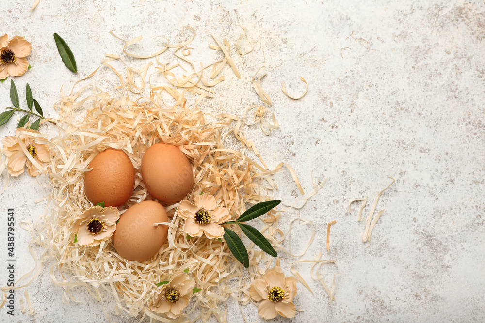 Easter eggs and flowers on light background Easter eggs and flowers on light background