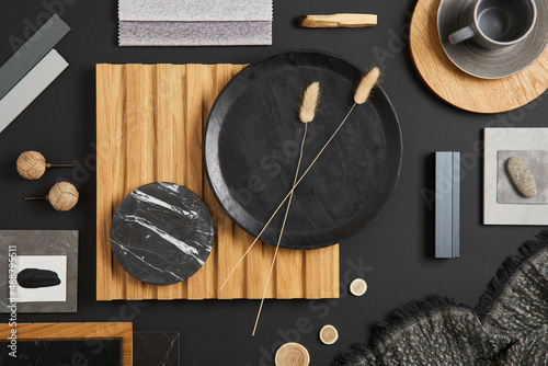 Stylish flat lay comosition of creative architect moodboard with black, beige and grey samples of textile, paint, wooden lamella panels and marble tiles. Top view. Copy space. Template.. photo