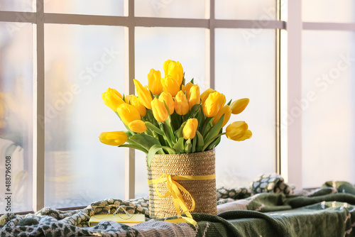 Bright yellow tulips in wov...
