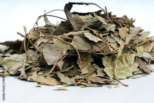 Dry Bel patra - aegle marmelos bel leaf Closeup over isolated background photo