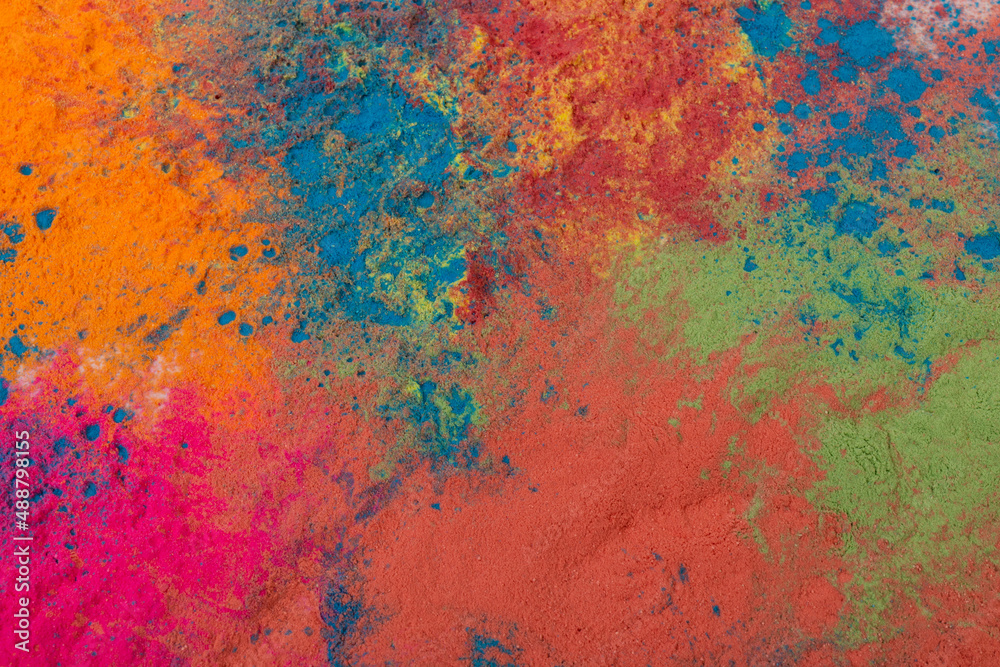 Abstract colorful Happy Holi background. Indian Holi festival of colours. Colorful powder explosion.