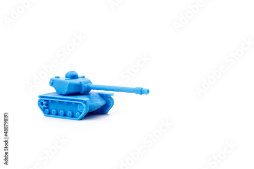 Toy tank of blue color. Close-up of little plastic ABS model. Blue filament. Objects printed by 3d printer Isolated on white background.