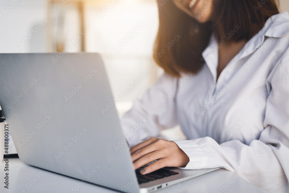 Close-up of woman working with laptop typing. Close-up of woman working with laptop typing.