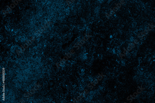 Abstract dark blue grunge textured background of old concrete wall surface