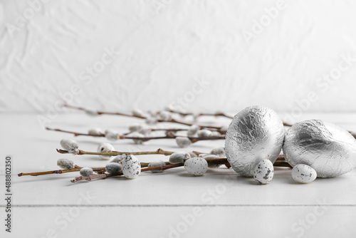 Fototapeta Naklejka Na Ścianę i Meble -  Easter eggs and pussy willow branches on  light background