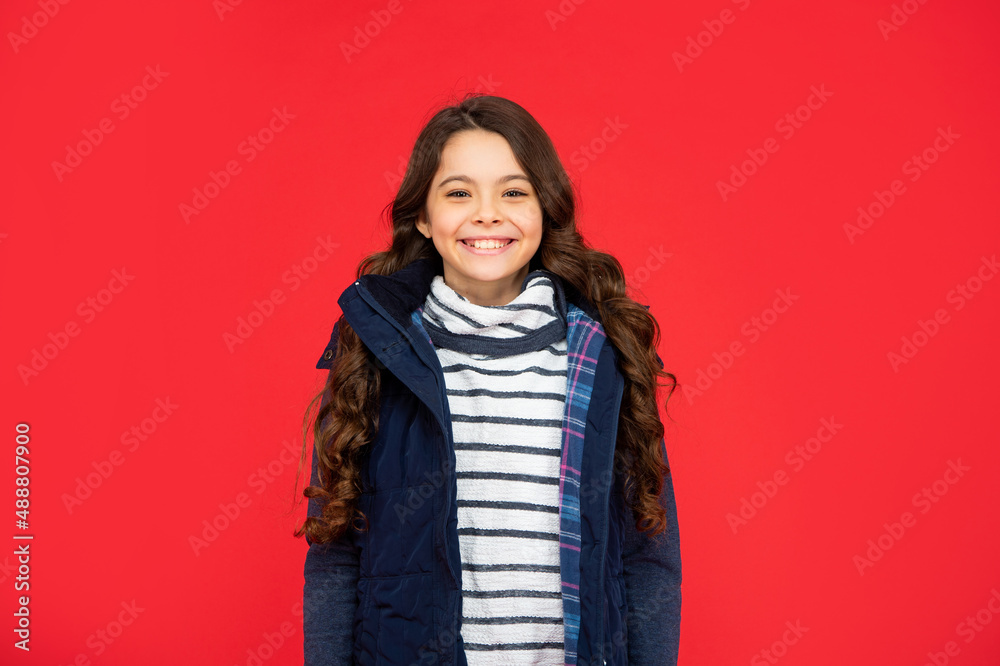 portrait of child wearing warm clothes. express positive emotion. winter fashion. emotional kid