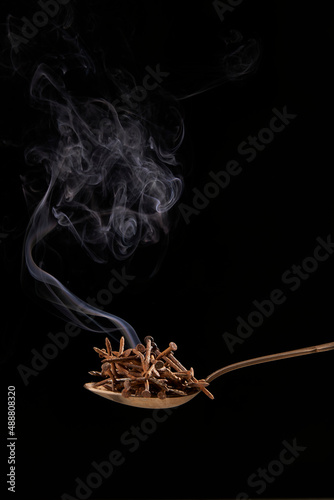 Screws on spoon with smoke photo