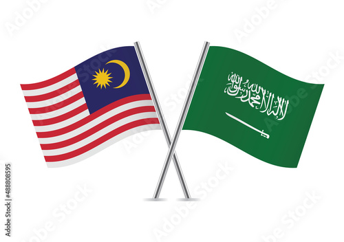 Malaysia and Saudi Arabia crossed flags. Malaysian and Saudi Arabian flags, isolated on white background. Vector icon set. Vector illustration.