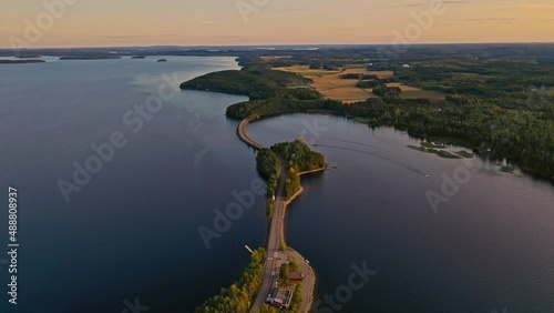 Aerial view of of islands on a blue lake Paijanne. Blue lake, islands and green forest from above on a sunny summer evening. Lake landscape in Finland photo