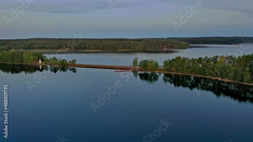 Aerial view of Pulkkilanharju Ridge, Paijanne National Park, southern part of Lake Paijanne. Landscape with drone. Blue lakes, road and green forests from above on a sunny summer day in Finland.