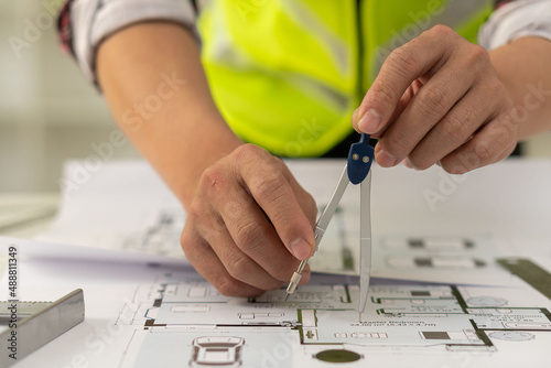 Engineers are designing houses for architectural projects. engineering tools at work Architects calculate and draft building construction drawings, civil engineering, architect concepts.