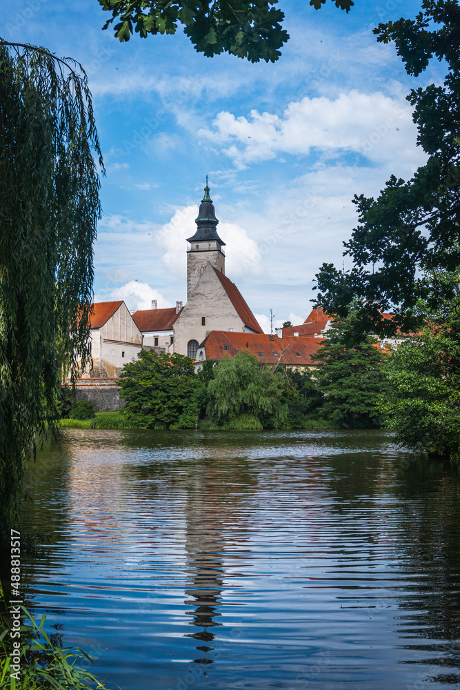 Church on the river in Telč, Czech Republic