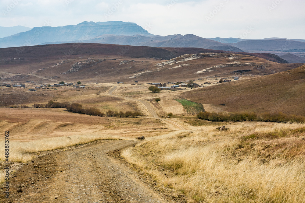 Travel to Lesotho. A dirt track goes deep into the mountains towards the Sehlabathebe National Park