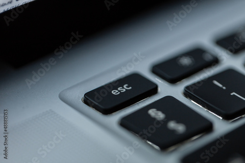 Computer keyboard with focus on the ESC button, macro. Exit concept
