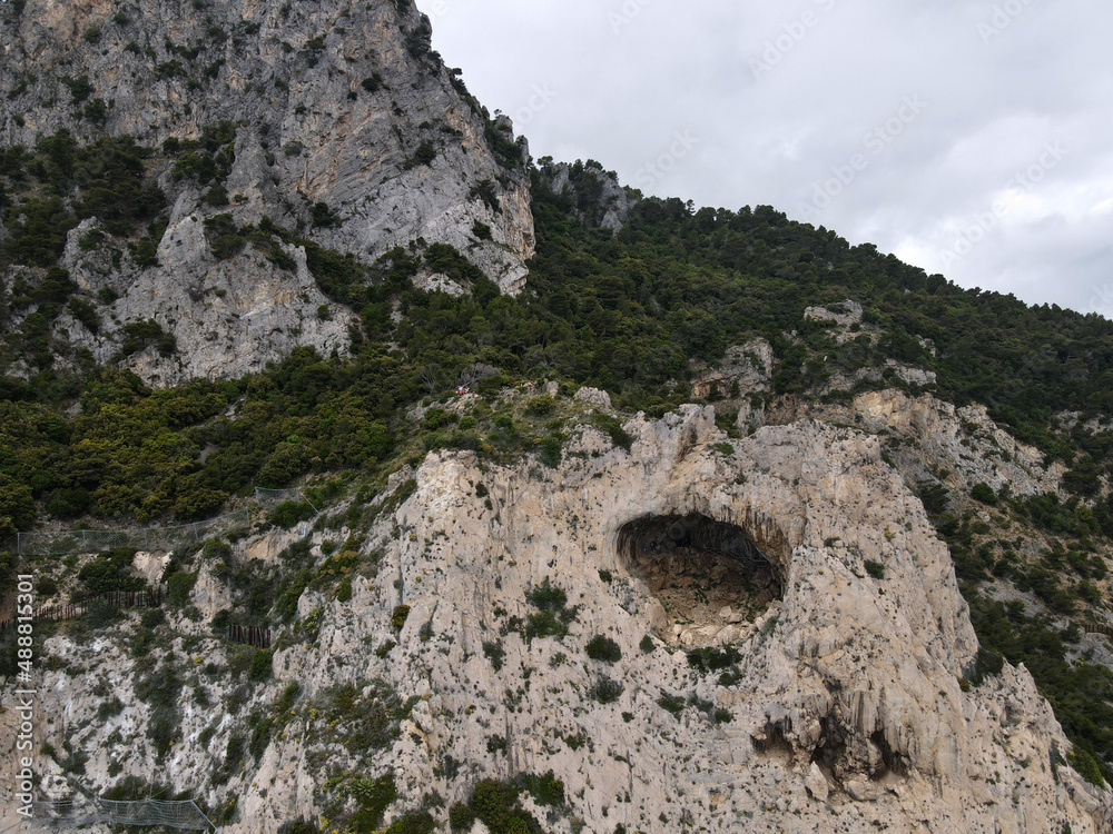 Aerial view of Grotta dei Falsari, Robber's Cave in Liguria, near Varigotti, Noli and Capo Noli. Drone photography of this cave in the rock with Aurelia street of Ligury, province of Savona.
