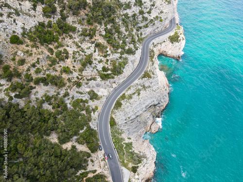 Aerial view of Aurelia street in Noli, Capo Noli and Varigotti, province of Savona. Drone photography from above of snake street snake in Liguria, north Italy, near Punta Crena and Spotorno. photo