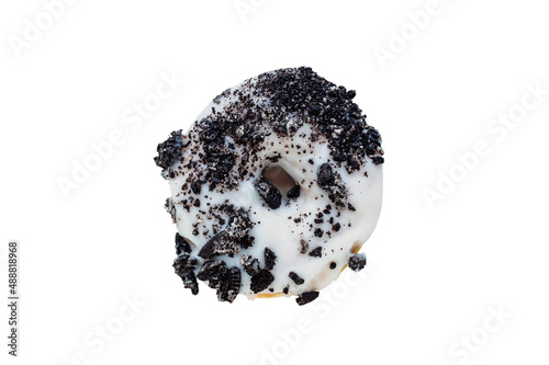 Flatlay of white chocolate frosted donut with crumbled creme filled cookies isolated with clipping path included. photo