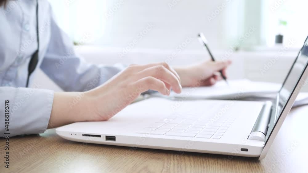 Close up image female hands typing on laptop keyboard Close up image female hands typing on laptop keyboard