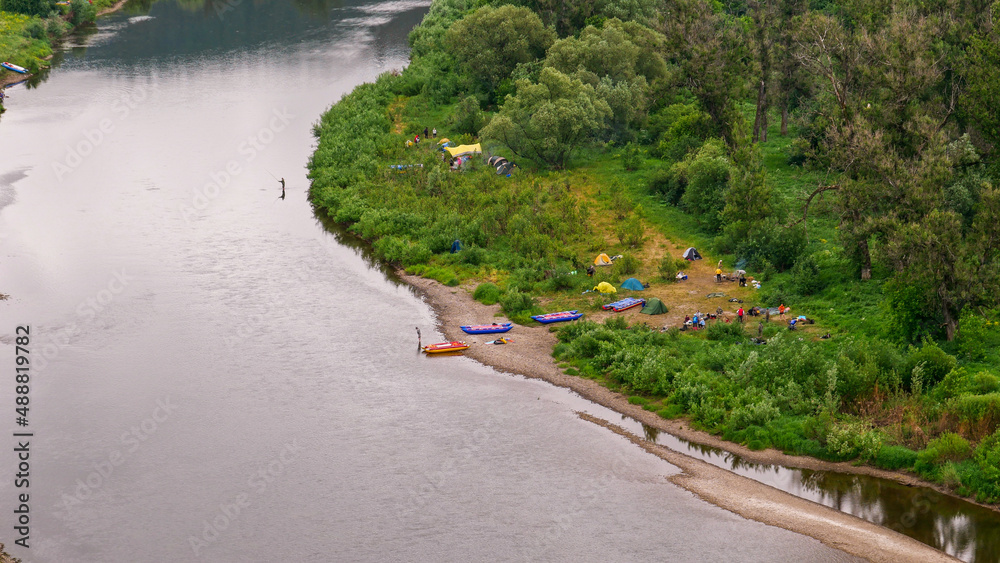 Calm river in the mountains. Aerial view of the river, flowing in the Ural Mountains among the impenetrable forest. Calm river in the mountains. Aerial view of the river, flowing in the Ural Mountains among the impenetrable forest.