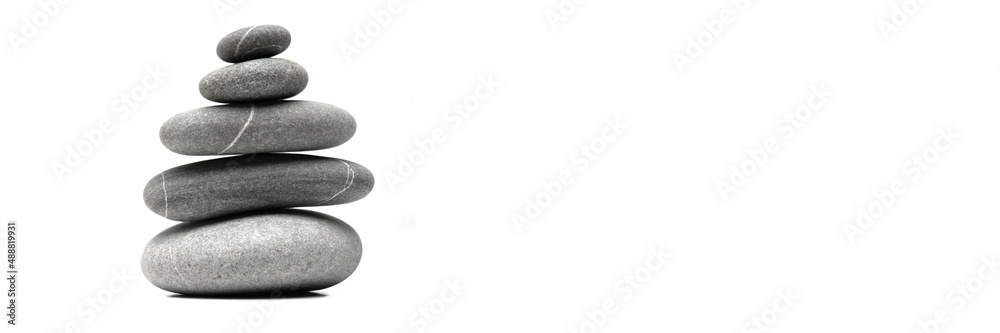 Pyramid of the balanced grey stones isolated on white background with copy space. Banner. Pyramid of the balanced grey stones isolated on white background with copy space. Banner.
