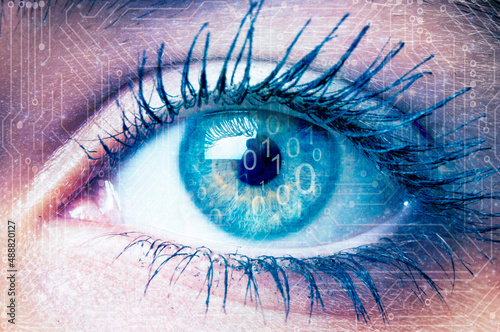 woman eye with binary digits and computer board superimposed
