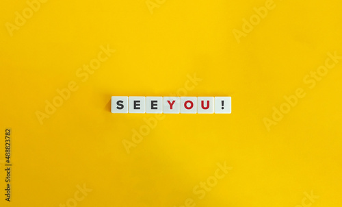 See You Phrase on Letter Tiles on Yellow Background. Minimal Aesthetics.
