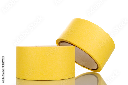 Two painter's tape, yellow, macro, isolated on a white background.