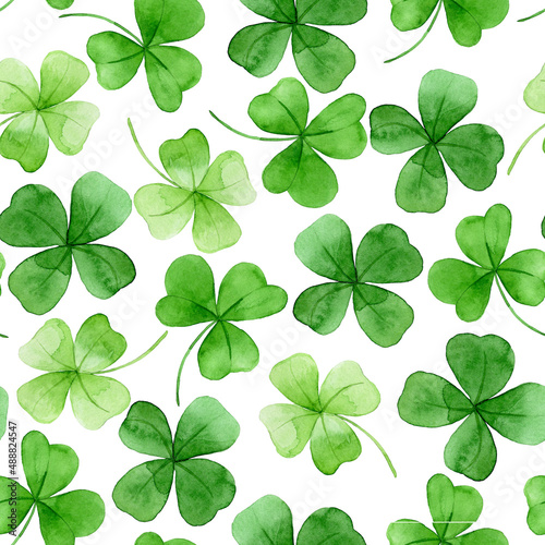 watercolor seamless pattern on the theme of st. patrick's day. green four-leaf clover leaves on a white background. holiday print