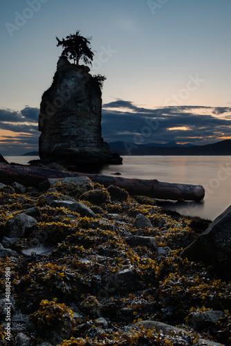 Sunset behind Siwash rock in Stanley park Vancouver Canada