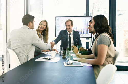 Presenting ideas to the team. Shot of corporate businesspeople meeting in the boardroom.
